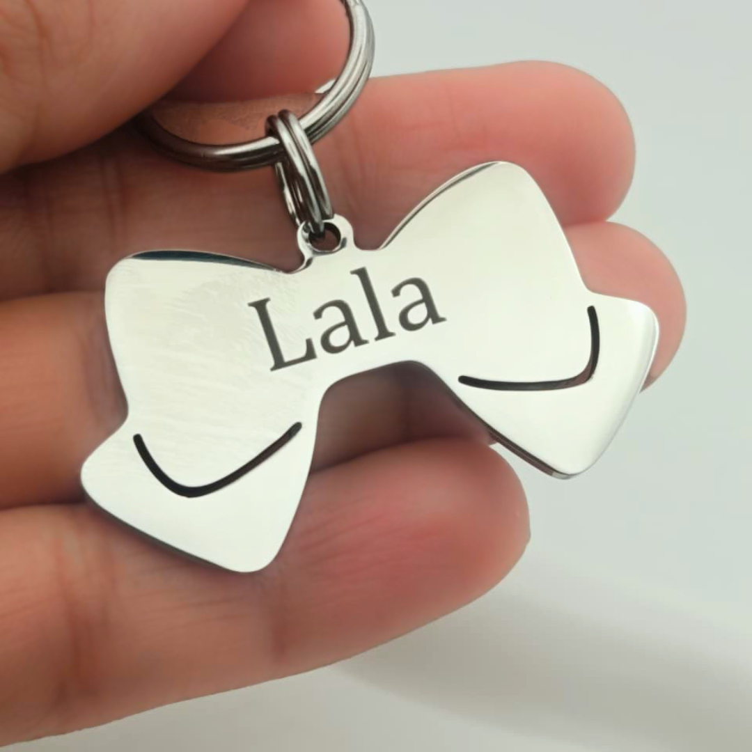 Plaquita para perros en forma de Lazo Plaquita para perros en forma de lazo de acero inoxidable