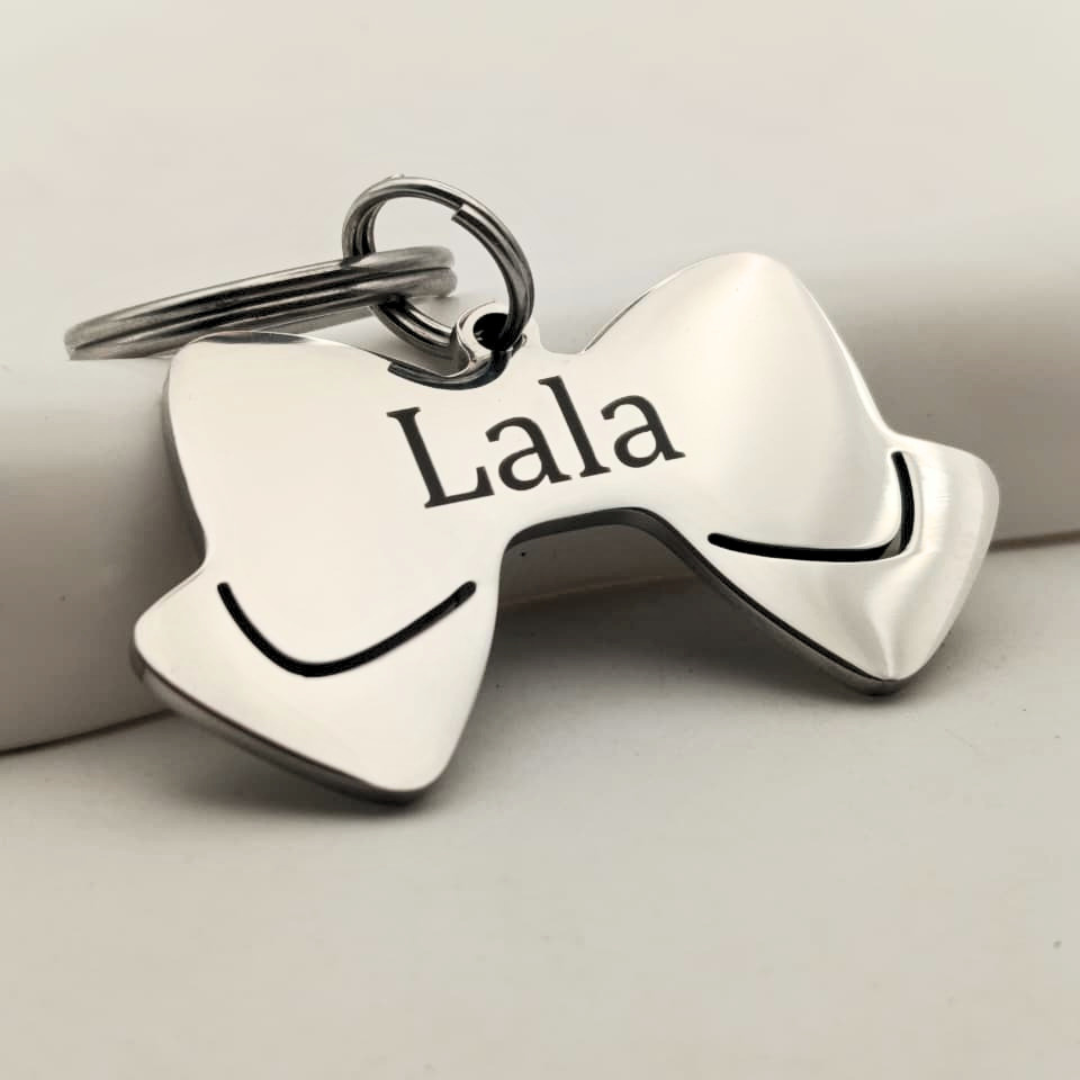 Plaquita para perros en forma de Lazo Plaquita para perros en forma de Lazo