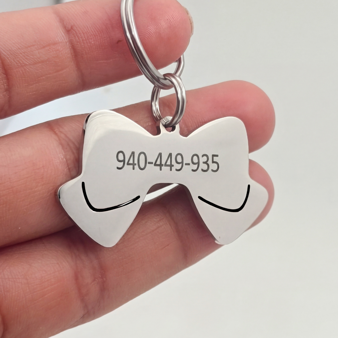 Plaquita para perros en forma de Lazo Plaquita para perros en forma de Lazo Con numero de telefono